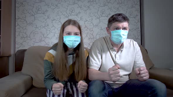 Daughter and Father in Masks