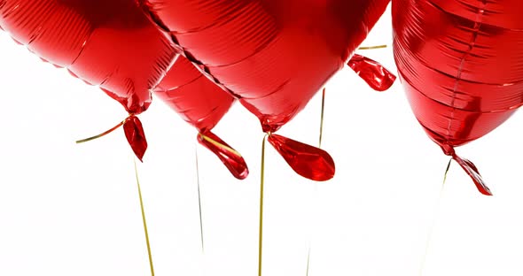 Red balloons floating in the air 4k