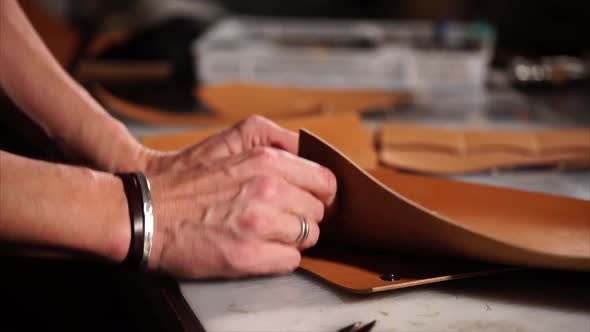 Close Up Shot of the Master Hands Who Works with Leather and Creates Accessories