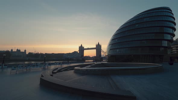 Time-lapse of Tower bridge at sunrise. Wide shot of Tower bridge,Tower of London and City Hall at su