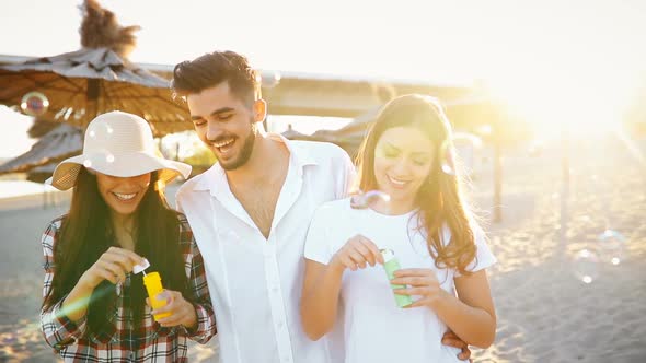 Group of Happy Young People Enjoying Summer Vacation