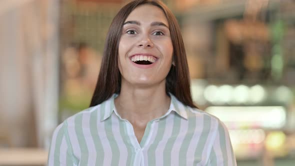 Young Latin Woman Saying Yes By Shaking Head