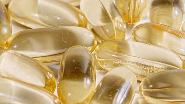 Yellow Capsules Medical Pills Rotating Closeup