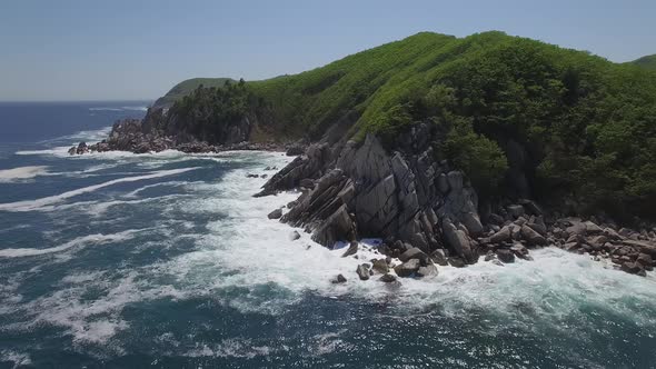 View From a Droneon a Stone Cape Washed By Strong Waves