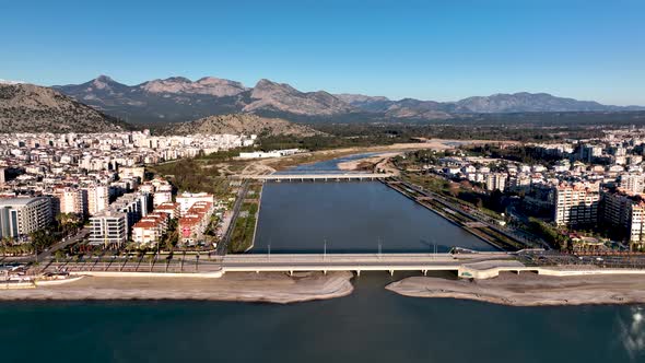 A mountain river flows into the sea Aerial View 4 K Antalya Turkey