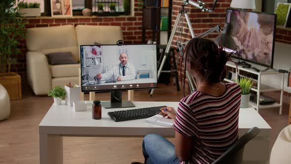 Female Patient Talking to Doctor on Telemedicine Videocall