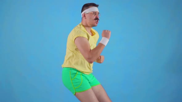 Funny Man Athlete From the 80's with a Mustache Makes the Workout Slow Mo