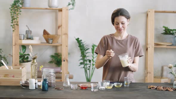 Woman Making Handmade Shea Butter Lotion