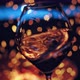 Closeup of Female Hand Waving Wine in a Glass on Defocused Cozy Camp Fire of Background - VideoHive Item for Sale
