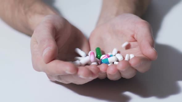 Various Pills Falling into Hands of Person, Pharmaceutical Industry, Medication