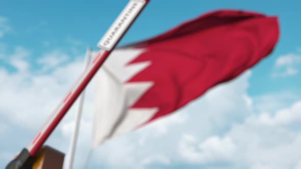 Closed Boom Gate with QUARANTINE Sign at the Bahraini Flag