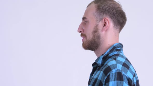 Profile View of Happy Bearded Hipster Man Talking