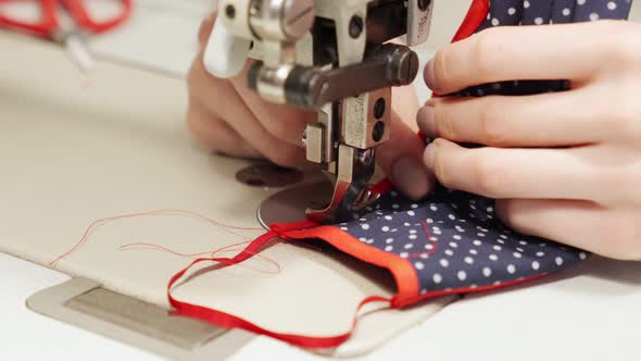 Female Tailor Making Breathing Hygienic Mask From Textile