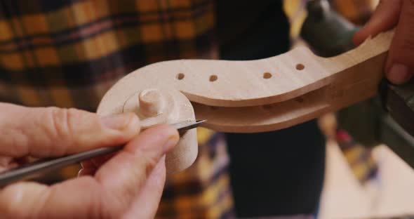 Female luthier at work in her workshop