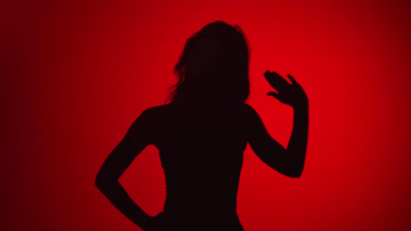 Black Shadow Portrait Woman Waving Hand Hello or Goodbye Isolated on Red