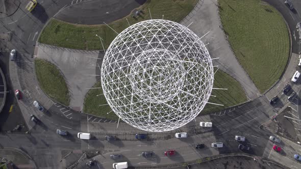 Aerial flyover of Belfast and the Rise Sculpture near the Falls Road and Westlink Motorway