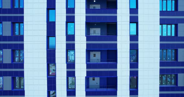 Multi-storey blue building with windows