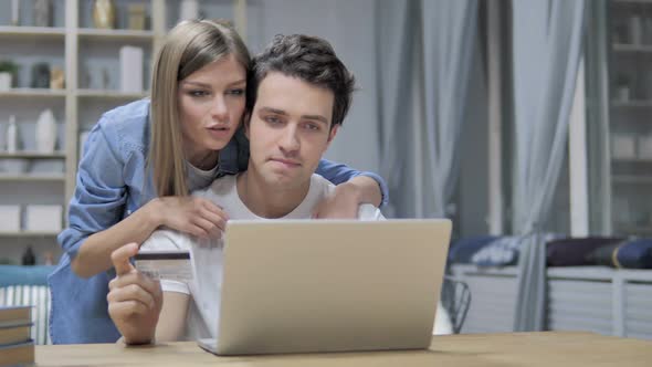 Young Couple Busy Doing Online Shopping on Laptop Online Banking