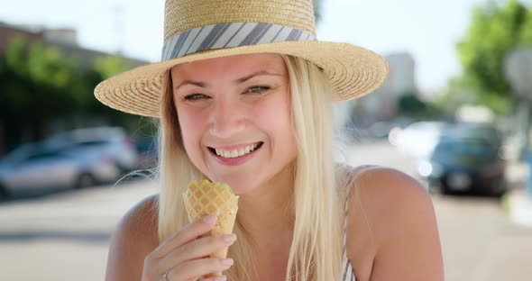 Close Up Beautiful Woman Eating Ice Cream. Happiness and Carefree Concept 