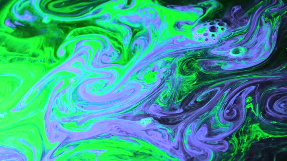 Vibrant Colours Of Ink Swirl Around Eachother