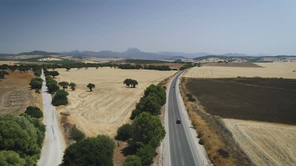 Aerial View Of Vehicles Driving On Countryside Road