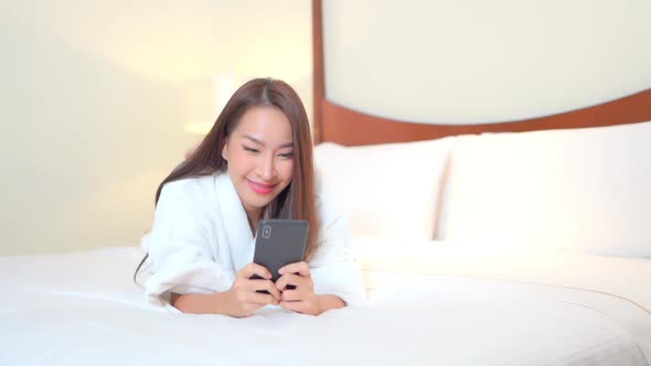 Young asian woman use smart phone