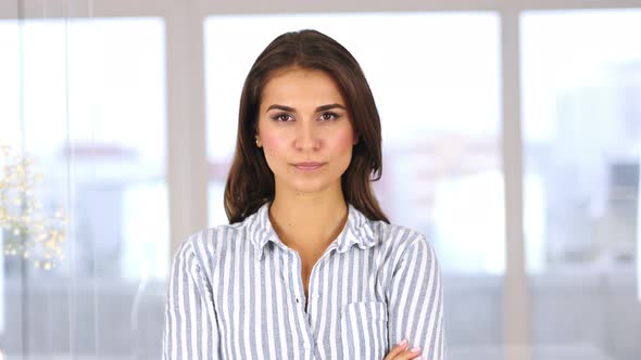 Angry Hispanic Woman Looking at Camera, Feeling Uncomfortable