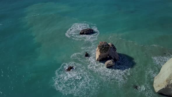 Aerial View of Crashing Waves on Rocks