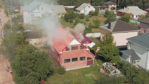 Aerial Drone Footage of a Fire in a Red Private House