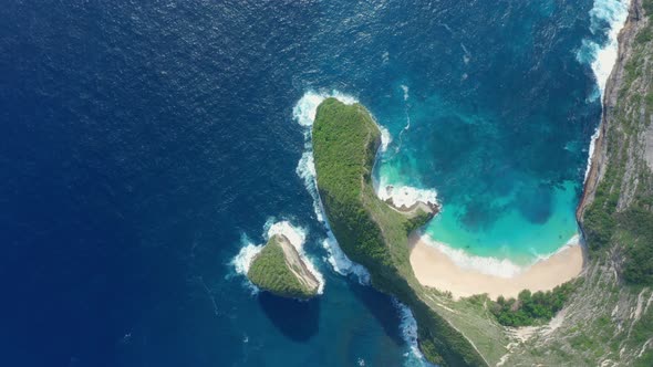 Aerial View of Stunning Promontory Nestled in the Middle of the Turquoise Sea