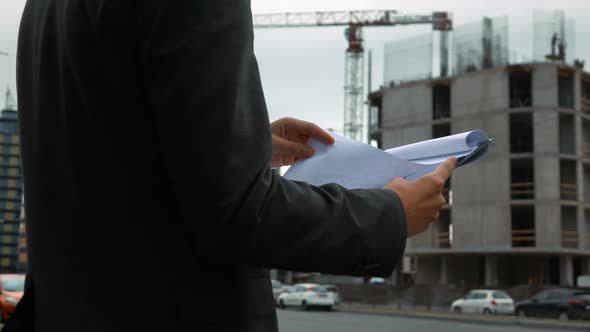 Project Manager Checking Construction Plan alt