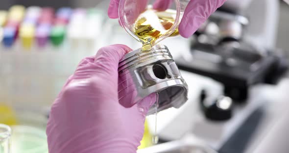 Automobile Piston is Examined in Laboratory and Poured with Oil