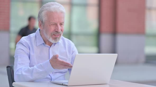 Outdoor Old Man Doing Video Chat on Laptop