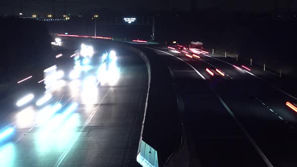 A Time Lapse of Cars That Go By on a Highway on a Dark Night.