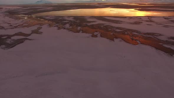 Flying over snow and ice covered landscape