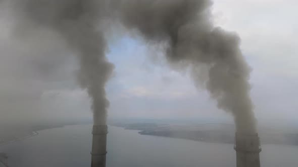 Aerial View of Coal Power Plant High Pipes with Black Smoke Moving Up Polluting Atmosphere