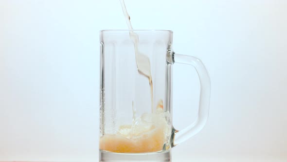 Beer pouring into a beer mug