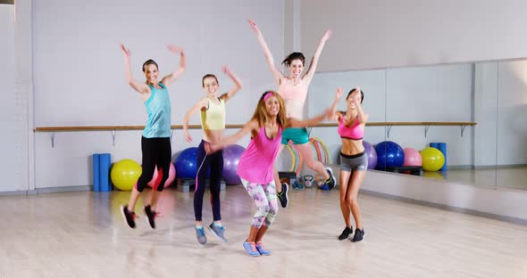 Group of female friends jumping