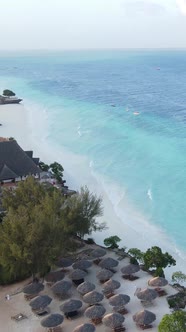 Vertical Video Boats in the Ocean Near the Coast of Zanzibar Tanzania