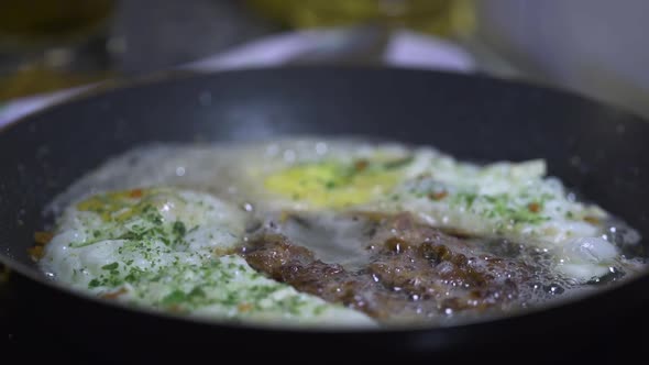 Eggs and bacon in a frying pan