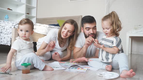 Family Preparing for Art Contest, Painting a Picture