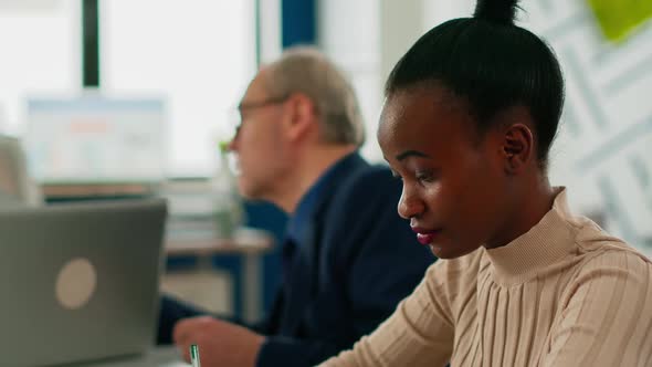 Black Manager Woman Looking at Camera Smiling