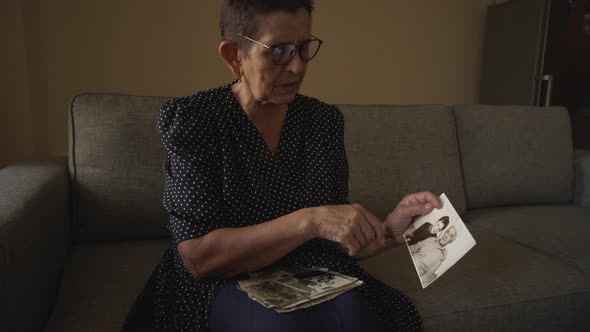 Senior Woman Watching Family Photo Album