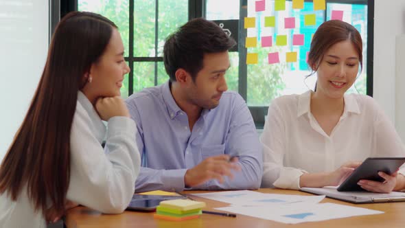 Group of young Startup coworkers working together to get ideas and marketing at office