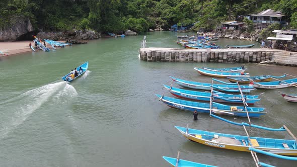 Aerial view of traditional boats in lagoon beach in Indonesia