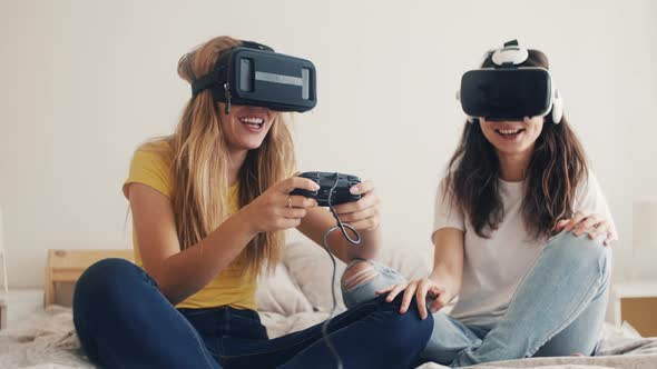 Exited Girls in VR Helmets at Home