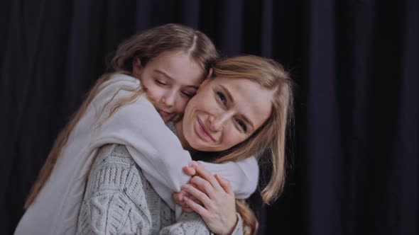 Mother and Daughter Cuddle Carefree