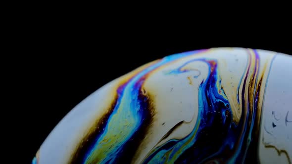 Multicolored Rainbow Colors of a Single Soap Bubble That Looks Like a Fantasy Planet Isolated
