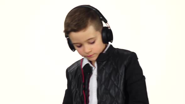 Smiling Boy Dj in Headphones Playing on Vinyl. Slow Motion