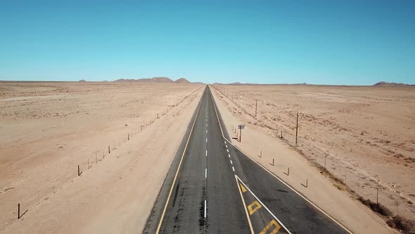 Namibian Road in Kalahari Desert in Africa. Aerial Drone Shot. Lanscape of the Road in the Desert. V